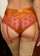 Back view of umber silk suspender & briefs.